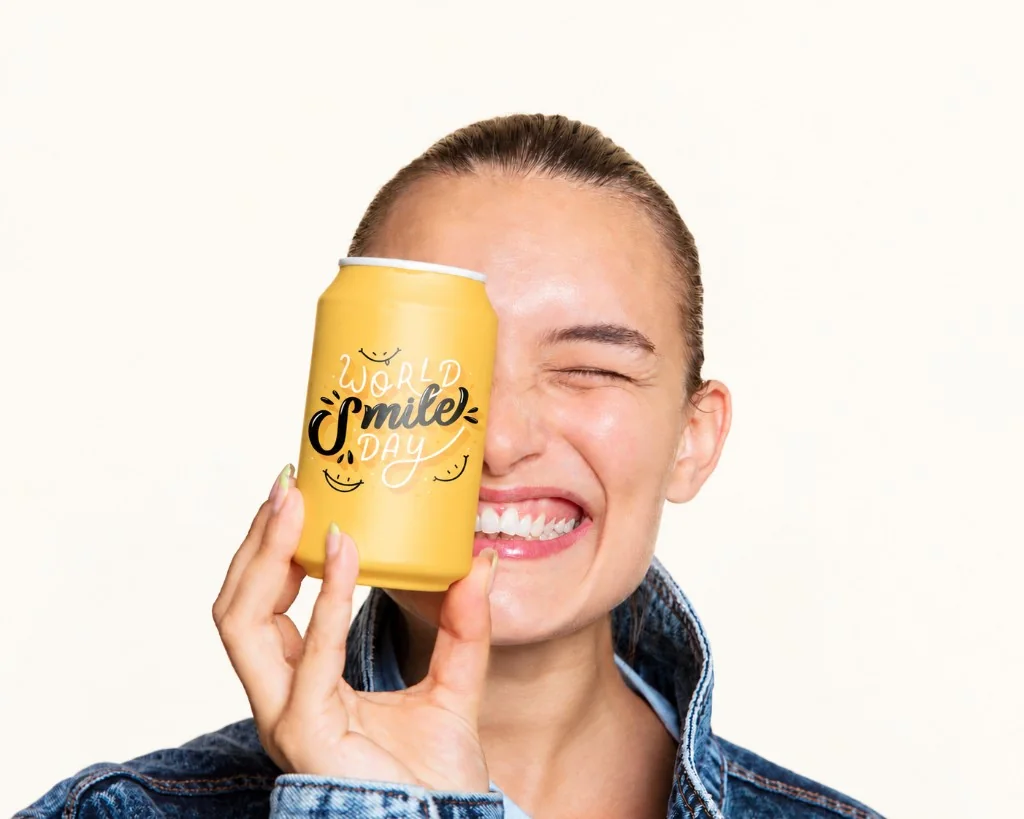 Smiling shopper holding a yellow drink can, happy after claiming a popup discount